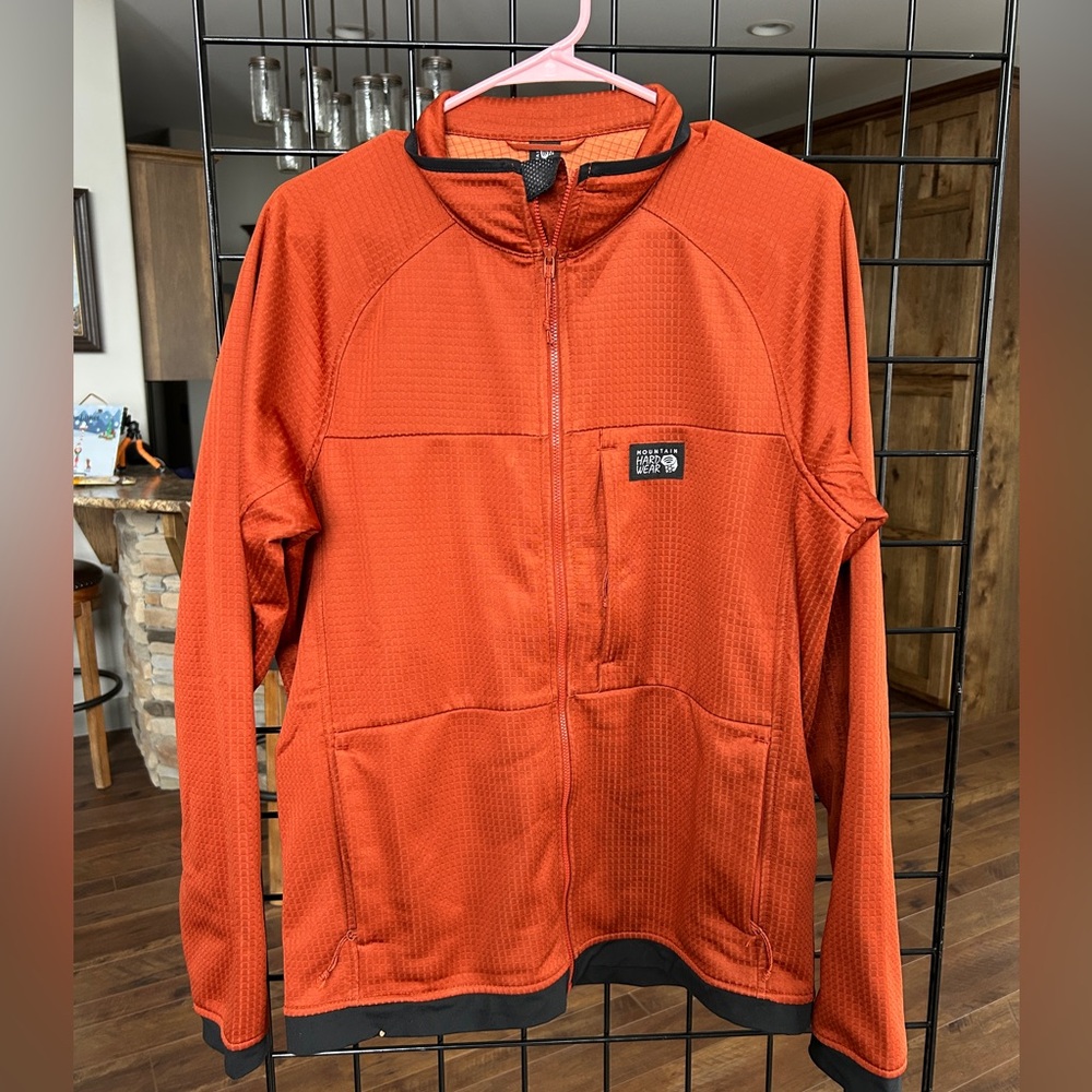 Mountain Hardwear Orange Softshell Jacket with Charcoal Gray Trim. Men’s Med.